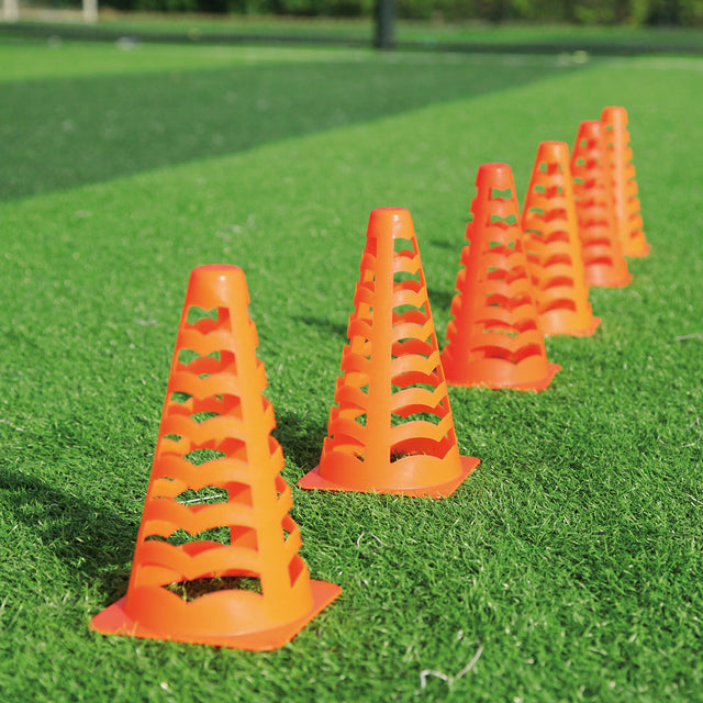 COLLAPSIBLE MARKER CONE 6PK | SAFETY PLAYZ lifestyle image, beacons & cones on gras, soccer cone, SPORTS ACCESSORIES, NET PLAYZ, NetPlayz, Sports Equipment Supplier, Sports Training Equipment Supplier, sports equipment manufacturers, United States Of America, USA, Canada, Europe, Africa, soccer ball, sports goods, sports equipment, athletic equipment, soccer equipment, soccer training equipment, soccer training accessories, training equipment, sports equipment manufacturers, athletic equipment manufacturers